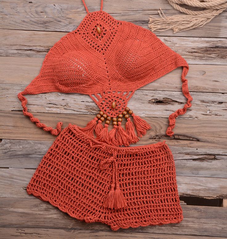 Soak up the sun with the bohemian flair of the Anissa Crochet Bikini Set, a must-have for your beach day escapades. This beautifully handcrafted two-piece swimsuit features intricate crochet detailing that exudes a laid-back, artisanal charm. The halter top is designed with a sensual neckline and openwork patterns that offer both coverage and a subtle peek of skin, while the matching high-waisted shorts with fringe trim add a playful touch to the ensemble. The wooden bead accents along the bodic Yoga Sets Outfit, Chest Design, Sets Outfit, Dropshipping Products, White Long Sleeve Dress, Accessories Bags Shoes, Swimsuit Set, Hand Wrap, Crochet Details