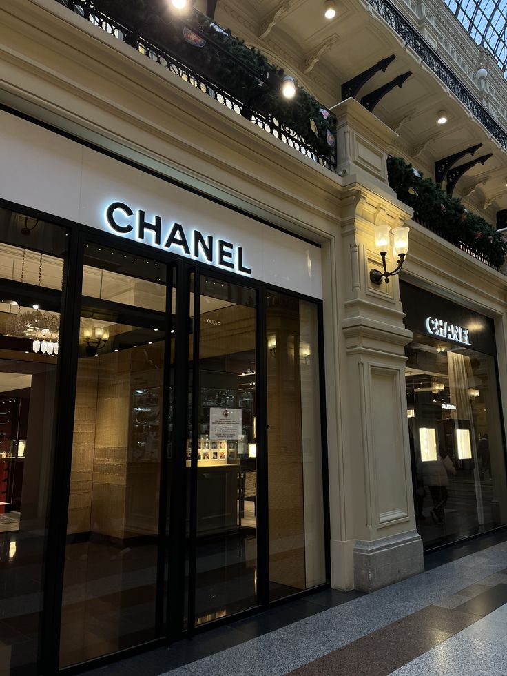 a chanel store front with its lights on