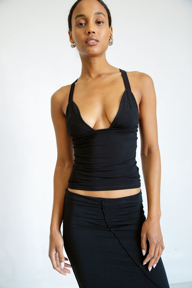 Description Crafted from our signature cotton-modal jersey, the Josephine adds sensuality to a classic tank top. It features double-lined rounded cups that are both comfortable and flattering, thick binding straps, fold-over detail under the bust, and baby flatlock stitch throughout. Pair with a voluminous pant or the The Line By K, Line By K, Office Fashion, New Wardrobe, Deep V Neck, The Line, Deep V, Blue Stripes, Basic Tank Top