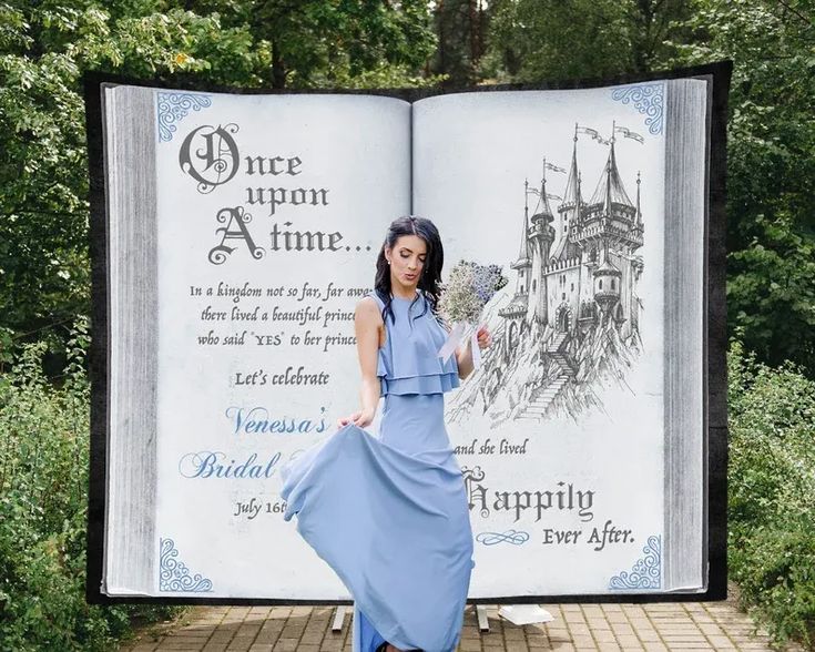 a woman standing in front of an open book