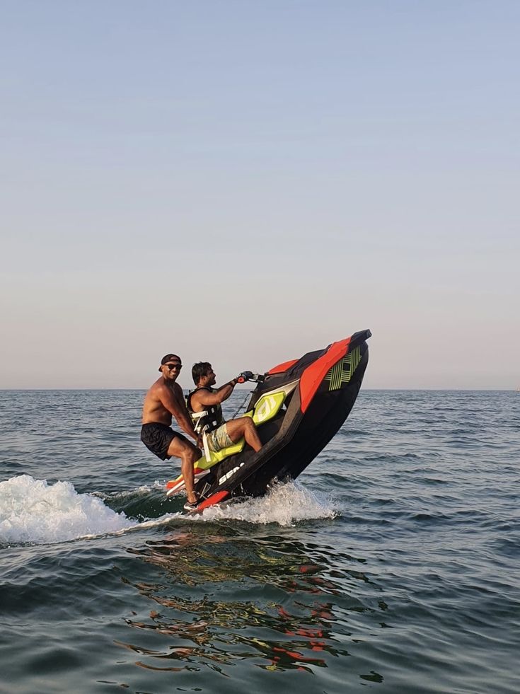 two people on a jet ski in the water