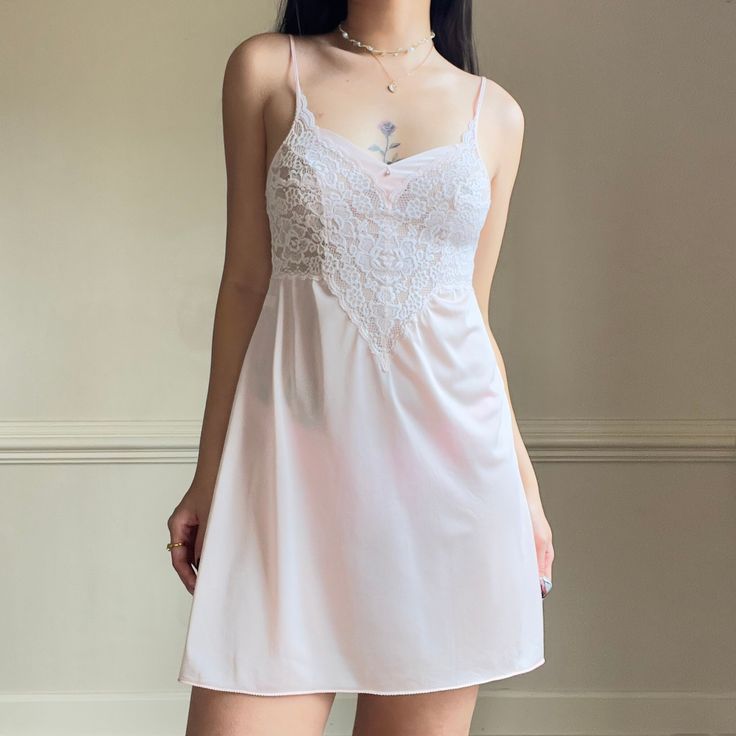 ༄ soft and feminine blush pink sheer slip featuring beautiful floral embroidery bustier and adorned with a diamond droplet ༄ size S ༄ immaculate condition, no flaws 🤍Model's 5ft4 34B 26W 🤍 Free shipping in US 🤍DM me with questions i am happy to answer any questions 🥰 Elegant Pink Camisole With Built-in Bra, Elegant Pink Camisole For Daywear, Feminine Sleeveless Camisole For Wedding Night, Feminine Camisole For Daywear, Feminine Wedding Camisole With Delicate Straps, Fitted Pink Camisole With Delicate Lace, Spring Wedding Night Camisole With Delicate Lace, Pink Lace Sleep Camisole, Feminine Lace Bodice Camisole For Wedding