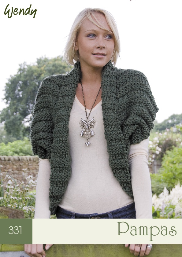 a woman standing next to a wooden fence wearing a green knitted sweater and jacket