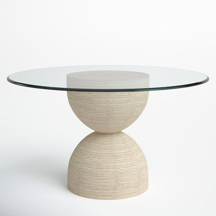 a round glass table with a white base and circular glass top on an isolated white background