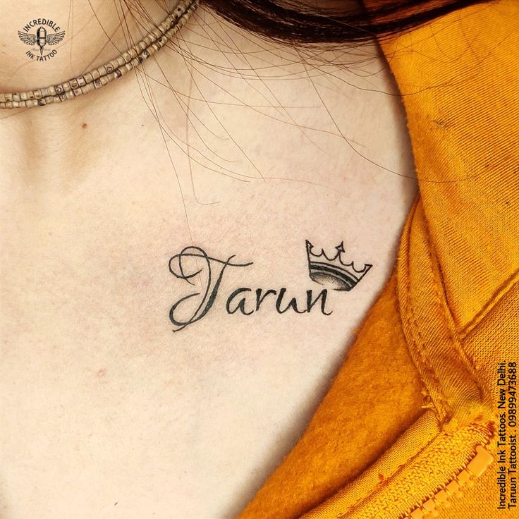 a woman's chest with the word tarun tattooed on her left side ribcage