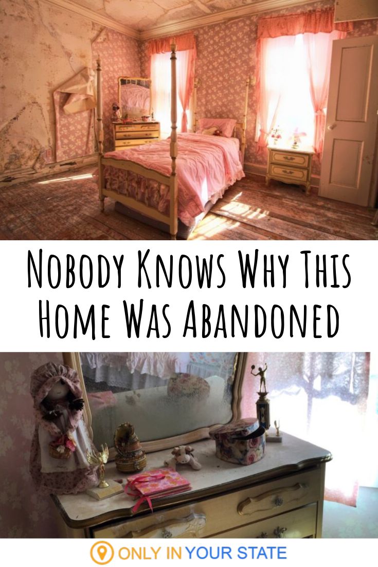 a bedroom with a bed, dresser and mirror that says nobody knows why this home was abandoned