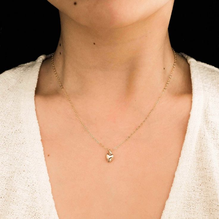 The Tiny Heart Necklace is the sweetest addition to any collection. Dainty yet durable, this necklace is ready for everyday wear, so you can feel the love on any occasion - date night, brunch with friends, or a coffee run by yourself! It also makes a precious gift for someone special to you. DETAILS Necklace length: 16" with 2" extender 14k gold filled charm, jump ring, & findings 8mm heart charm Tiny Heart Necklace, Coffee Run, Detailed Necklace, Precious Gift, Heart Hoop Earrings, Heart Pendant Gold, Gold Heart Necklace, Tiny Heart, Simple Jewelry