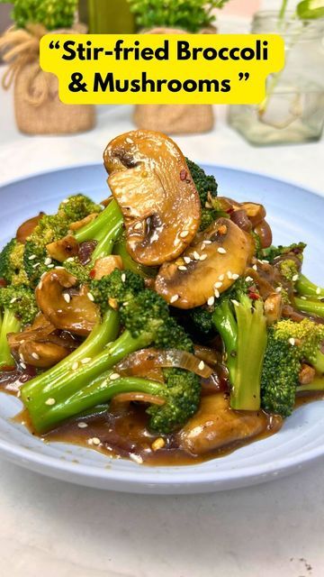 stir fried broccoli and mushrooms on a plate