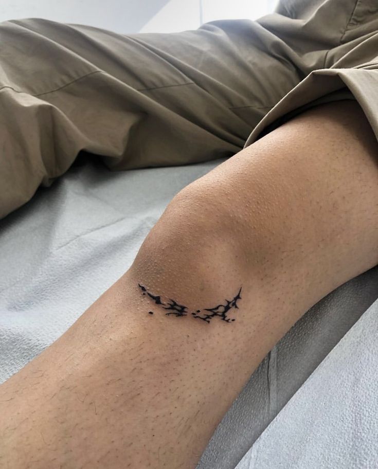 a person with a tattoo on their arm that has three birds flying in the sky