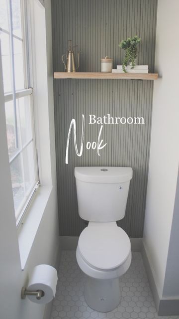 a white toilet sitting in a bathroom next to a window with the words bathroom nook above it