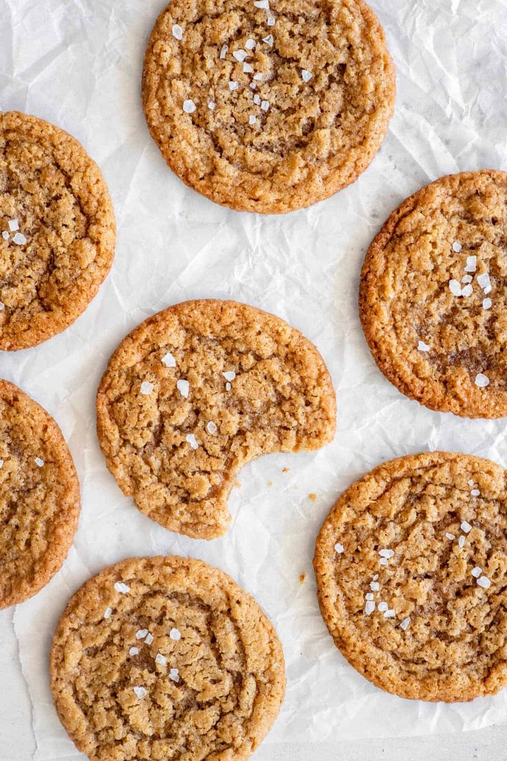 several cookies with white flecks and sugar on top are arranged in a circle