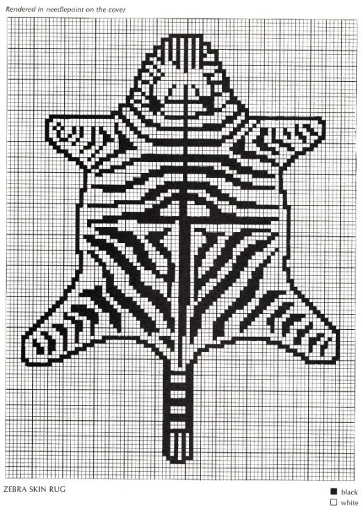 a cross stitch pattern with a zebra's head on the bottom and an arrow in the middle