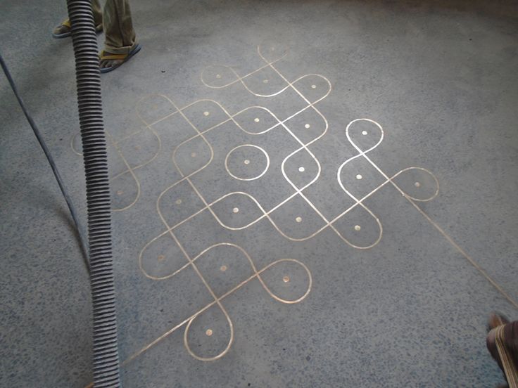 a person standing in front of a drawing on the ground