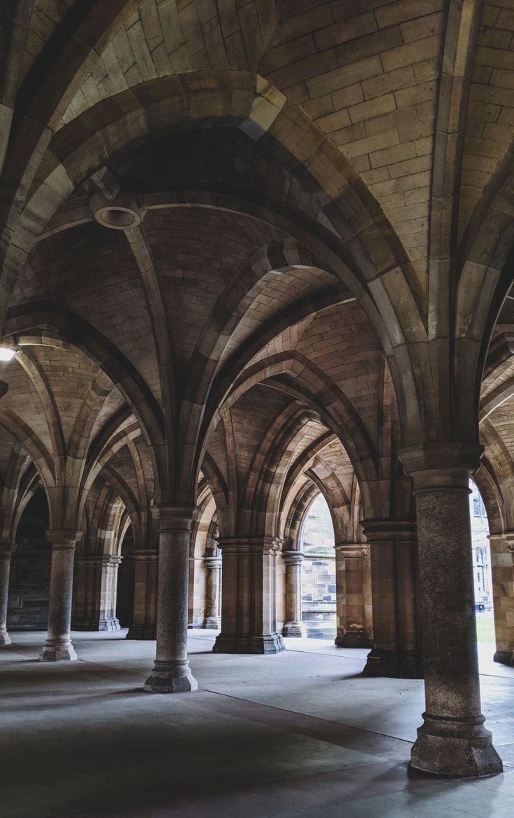 an empty cathedral with arches and pillars