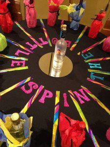 a table topped with lots of bottles and decorations