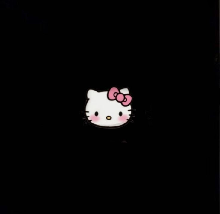 an image of a hello kitty wallpaper in the dark room with no one on it