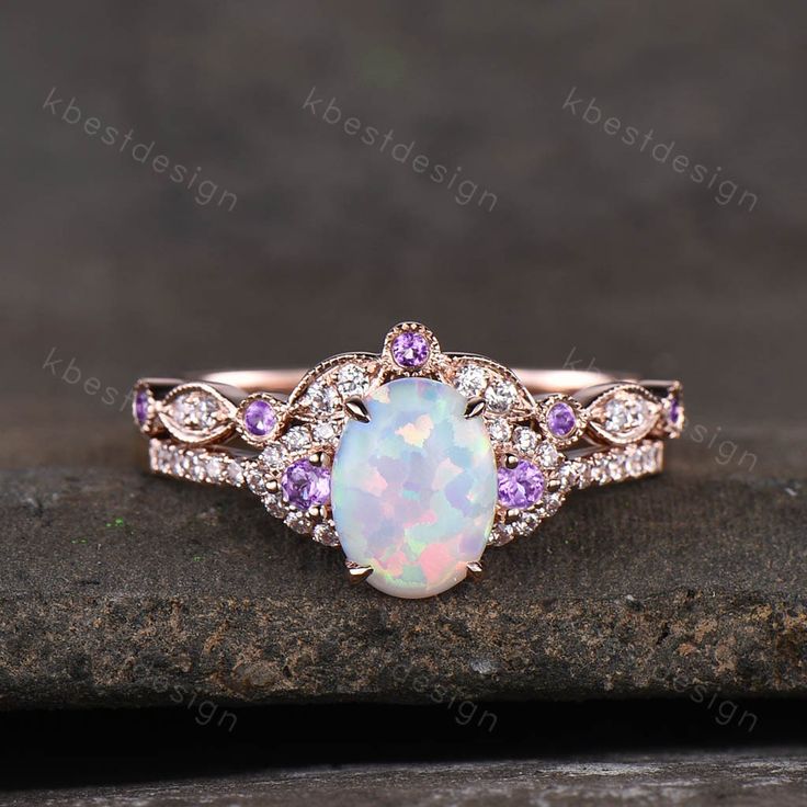 This is a beautiful lab created white fire Opal engagement ring in rose gold. Main Stone: 6x8mm oval cut opal. Side stone: Amethyst + Moissanite. Wedding band: Curved band, Moissanite.. This ring is marked G10K/G14K. I accept custom making order.Please contact me if you need this service. For all the jewelries,there is a 14 days money back guarantee.You can return it in the time frame without any questions.However there maybe handcrafted fee and shipping fee deducted from the original payment as Ruby Engagement Ring Set, White Opal Engagement Ring, Opal Engagement Ring Rose Gold, Fire Opal Engagement Ring, Opal Engagement Ring Set, Oval Cut Ring, Opal Engagement Ring, Cute Engagement Rings, Future Engagement Rings