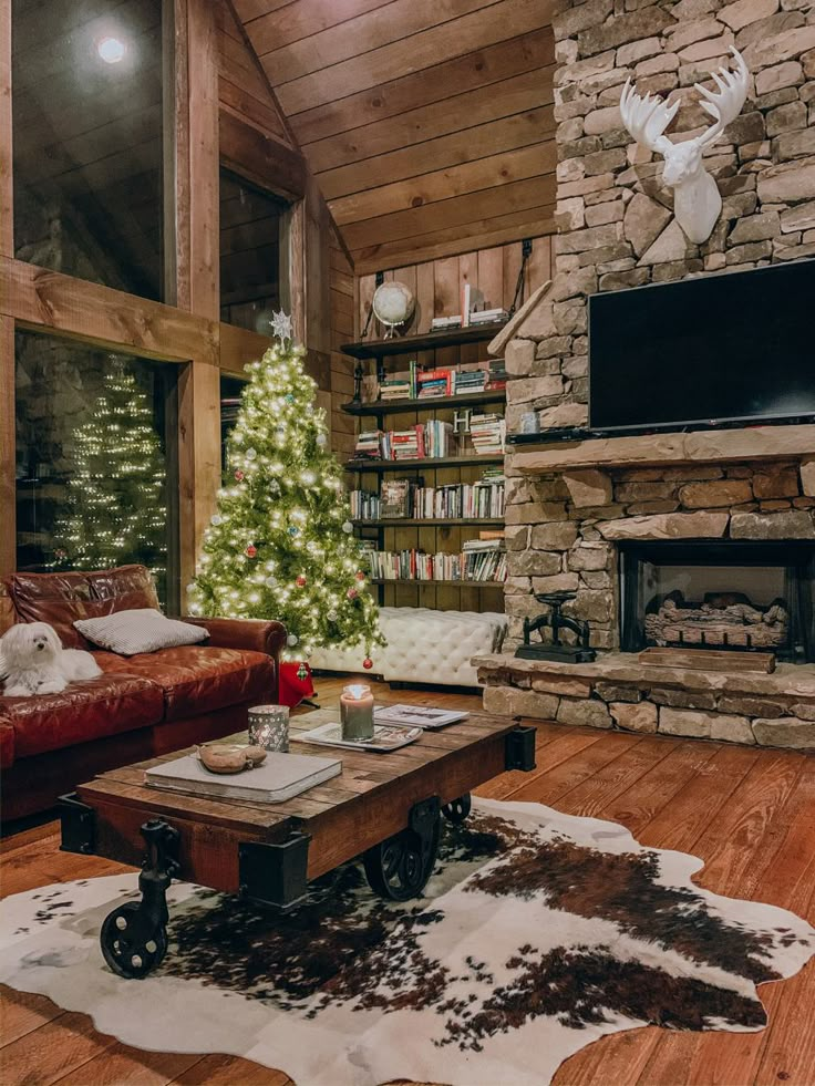 a living room with a christmas tree in the corner