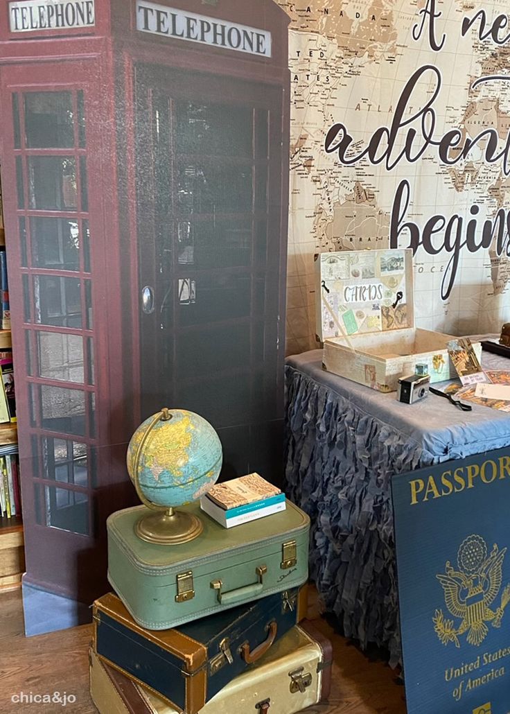 several suitcases stacked on top of each other in front of a sign that says telephone booth