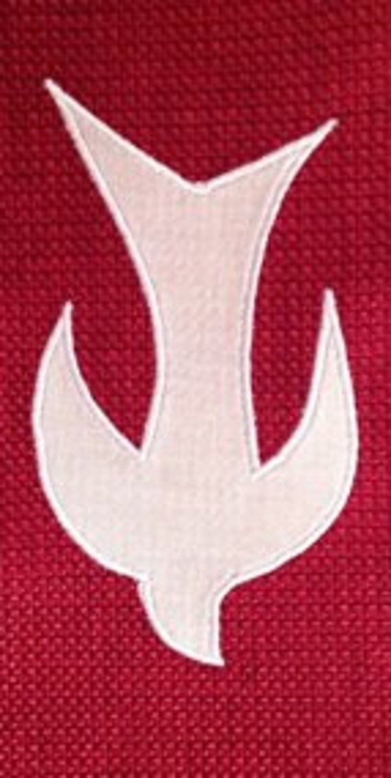 the star wars logo is shown in white on a red background, and it appears to be made out of knit fabric