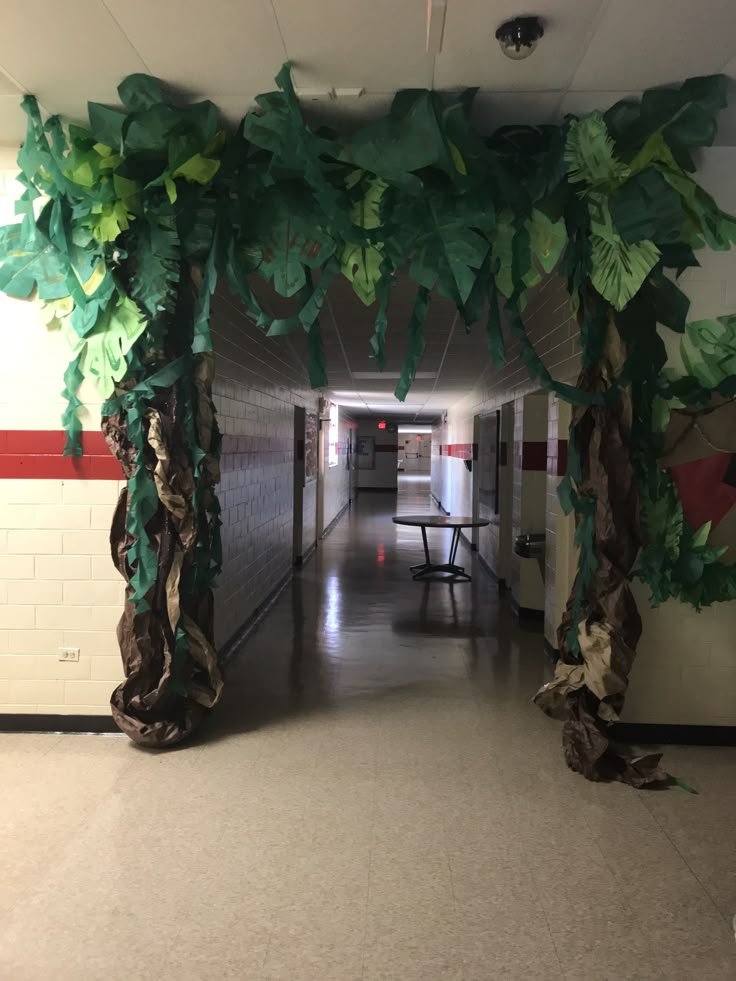 a hallway decorated with paper leaves and trees