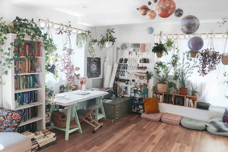 a room filled with lots of plants and books