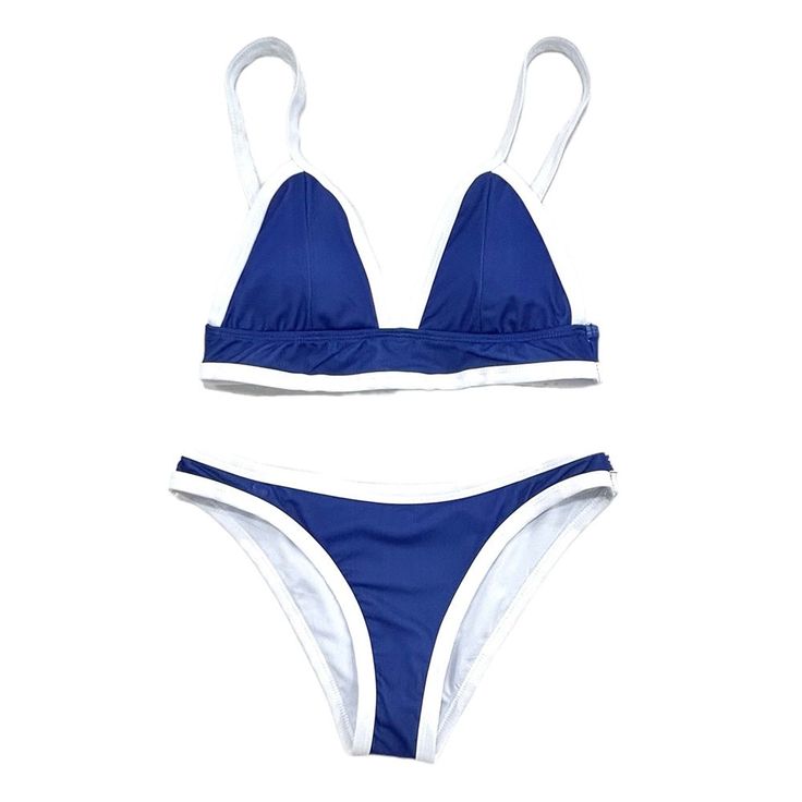 ALL SALES FINAL. No Refunds/Exchanges on Warehouse Sale items."Get ready to make a splash in this navy blue color block bikini for women. With its unique design and playful color combination, you'll stand out at the beach or pool. Perfect for those who love to have fun in the sun (and look stylish doing it)!" Sporty Blue Swimwear For Beach Season, Navy Summer Tankini For Beach Season, Blue Sporty Tankini For Beach Season, Sporty Blue Tankini For Beach Season, Royal Blue Swimwear For Summer Vacation, Fitted Blue Color Block Tankini, White Swimwear With Contrast Color For Beach, Summer Navy Triangle Top Swimwear, Navy Triangle Top Swimwear For Summer