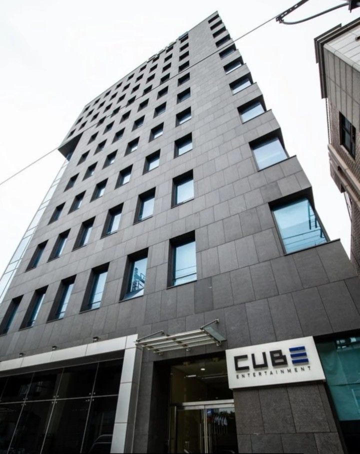 a tall building with many windows and a sign on the side that says, club