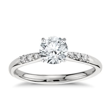 a white gold engagement ring with diamonds on it