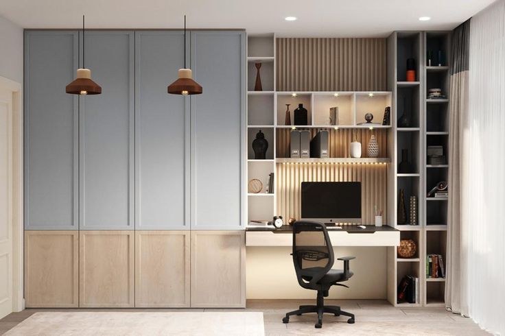 a home office with built - in shelving and desk