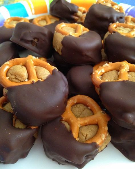 chocolate covered pretzels are on a plate