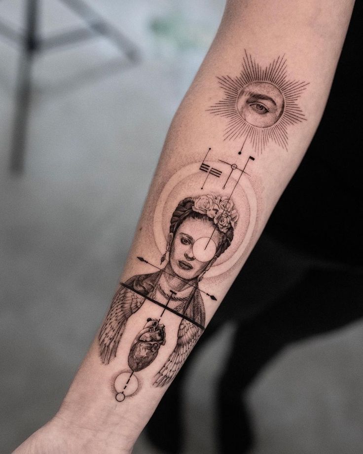 a woman's arm with tattoos on it and an image of the sun above her