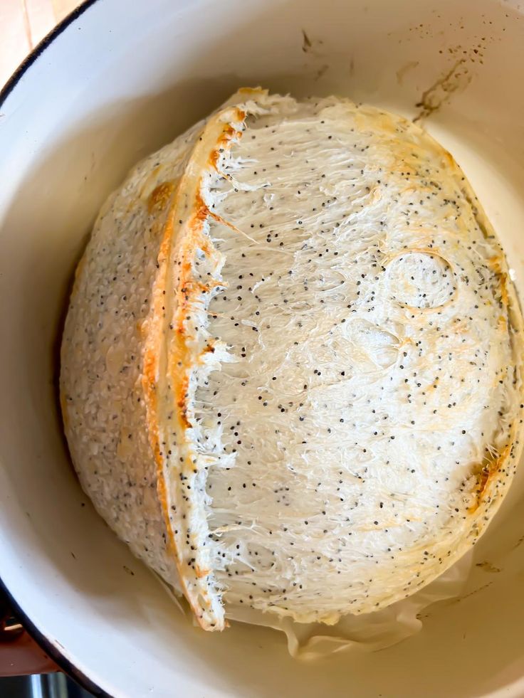 a white bowl filled with food on top of a table