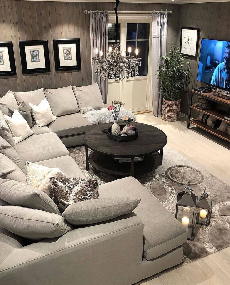 a living room filled with furniture and a flat screen tv