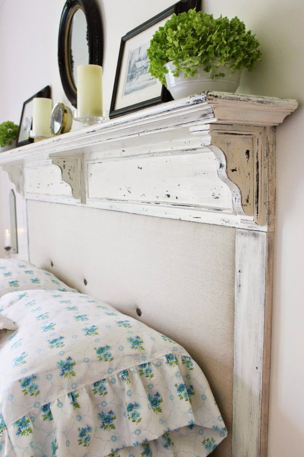 an old white headboard with flowers on it