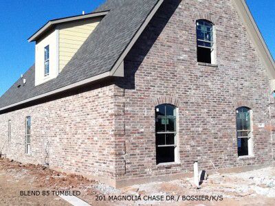 an old brick building is being built