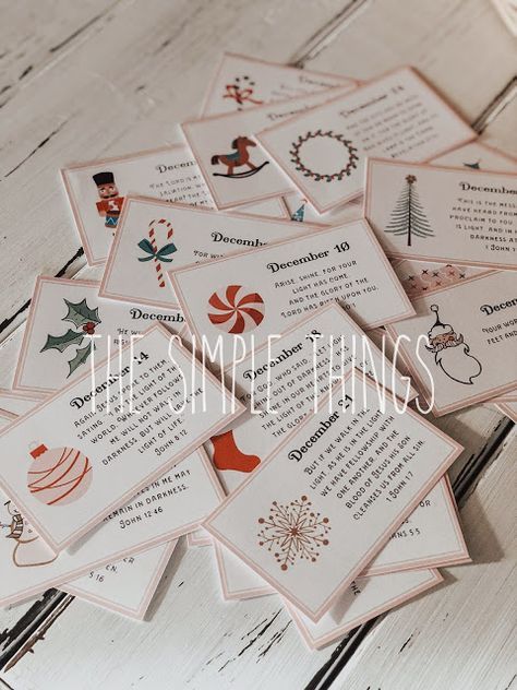 a pile of christmas cards sitting on top of a wooden table