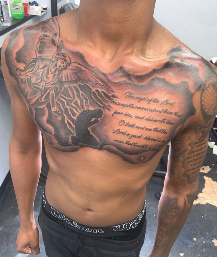 a man with a large tattoo on his chest