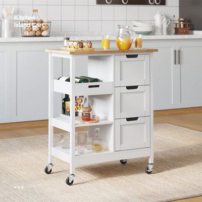 a kitchen island cart with drawers on wheels