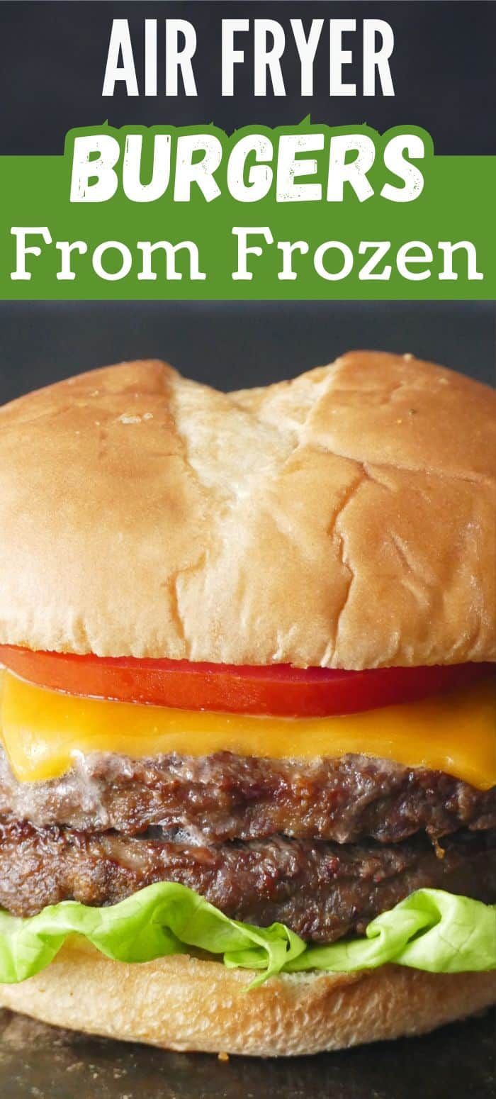 an air fryer burger with lettuce, tomato and cheese on the bun