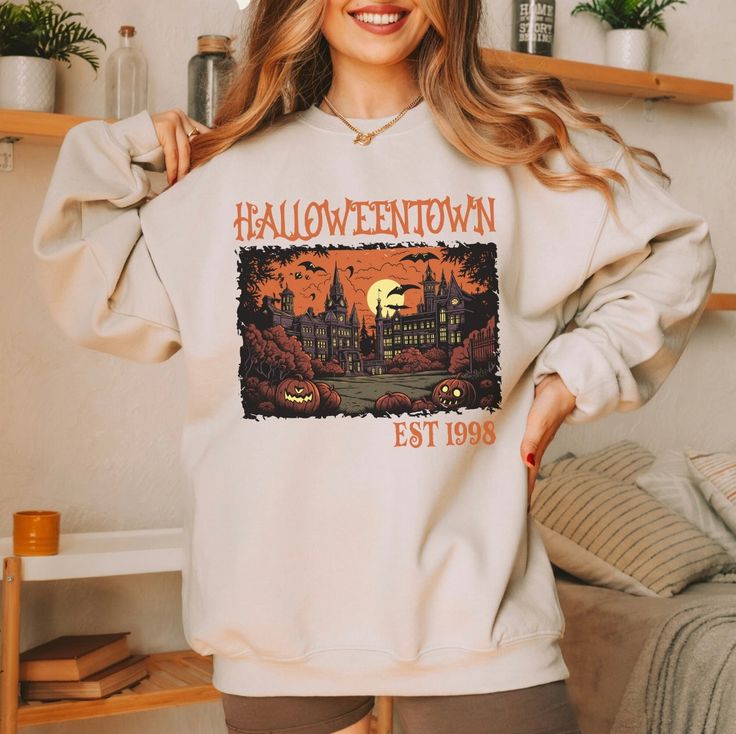 Halloweentown Est 1998 Tee/Sweatshirt Comes in 4 colors - White, Ash Grey, Tan and Black Tee: $32Sweatshirt: $48Unisex sizing Sizes: S-4XLTAT: 7-10 business days White Ash, Halloween Town, Accessories Bags Purses, Beauty Collection, Christmas Jewelry, White Tee, Beach Jewelry, Ash Grey, Summer Sale