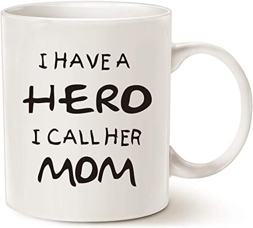 a white coffee mug with the words i have a hero, i call her mom