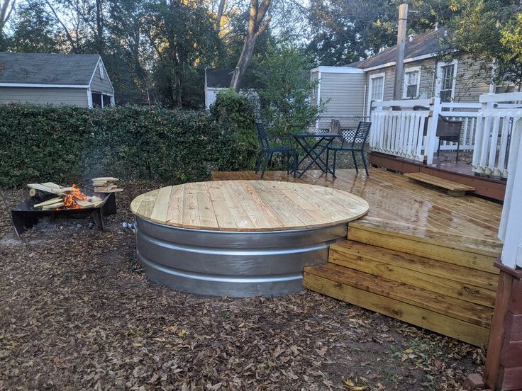 a fire pit sitting on top of a wooden deck