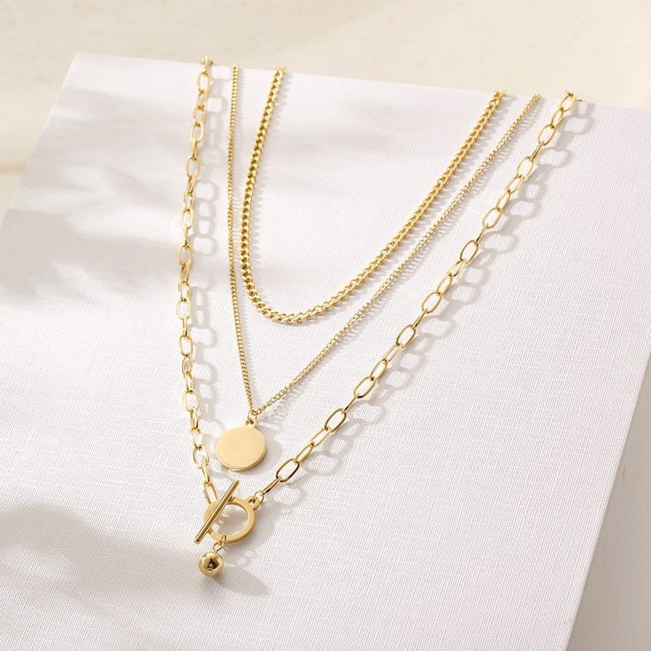 Stainless Steel | 316L. 14K Gold Plating. Hypoallergenic. Water Resistant. Gold Tarnish Resistant Chain Necklace, Minimalist Gold Jewelry With Double Chain, Gold Tarnish-resistant Chain Necklace, Minimalist Gold Double Chain Jewelry, Classic Gold Layered Necklace With Clavicle Chain, Modern 14k Gold-filled Necklaces, Modern 14k Gold Filled Necklaces, Modern 14k Gold Filled Gold Necklace, Gold Double Chain Necklace In 14k Gold