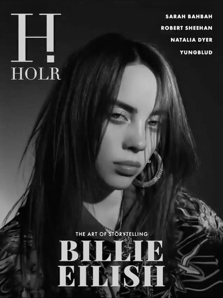 a woman with long hair and hoop earrings on the cover of magazine h holr