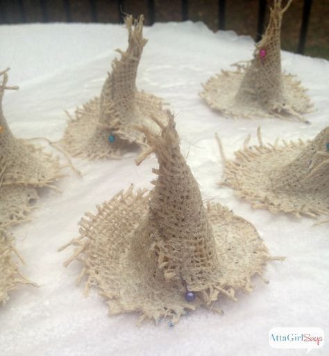 some very pretty little burlocks on top of a white cloth covered tablecloth