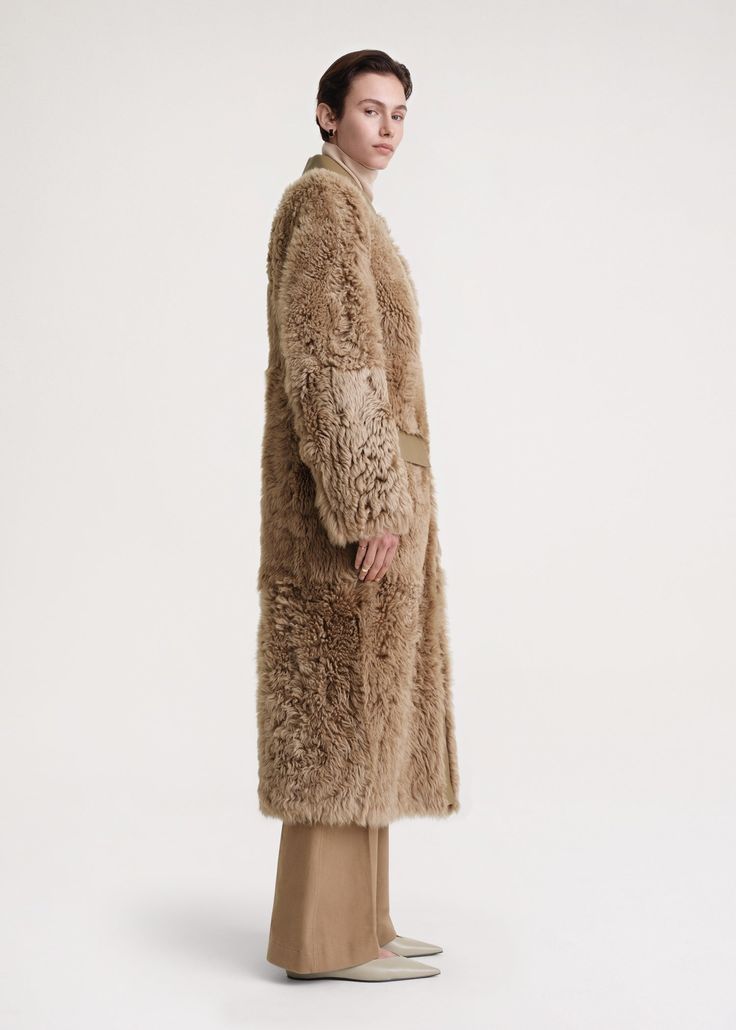 Warm TOTEME coat made from heavyweight shearling with an alluring curly texture. It has a smooth leather collar and pocket flaps to match the interior and fastens with concealed buttons. Add tonal separates to complete a statement winter look. Toteme Coat, Shearling Coat, Leather Collar, Winter Looks, Smooth Leather, Texture, Collar, Leather