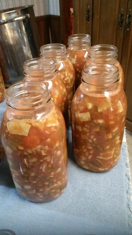 several jars filled with food sitting on top of a table