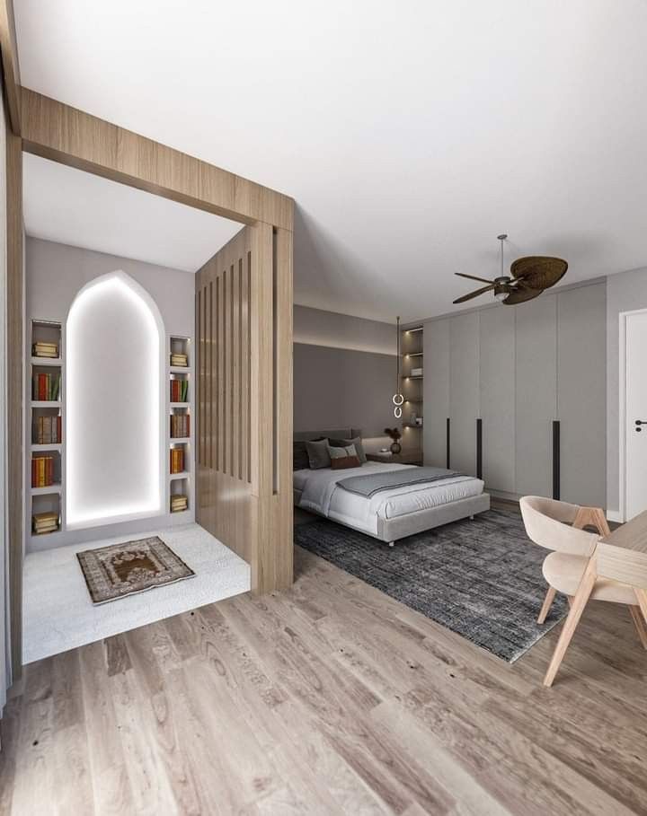 a bedroom with a bed, desk and chair in it next to a book shelf