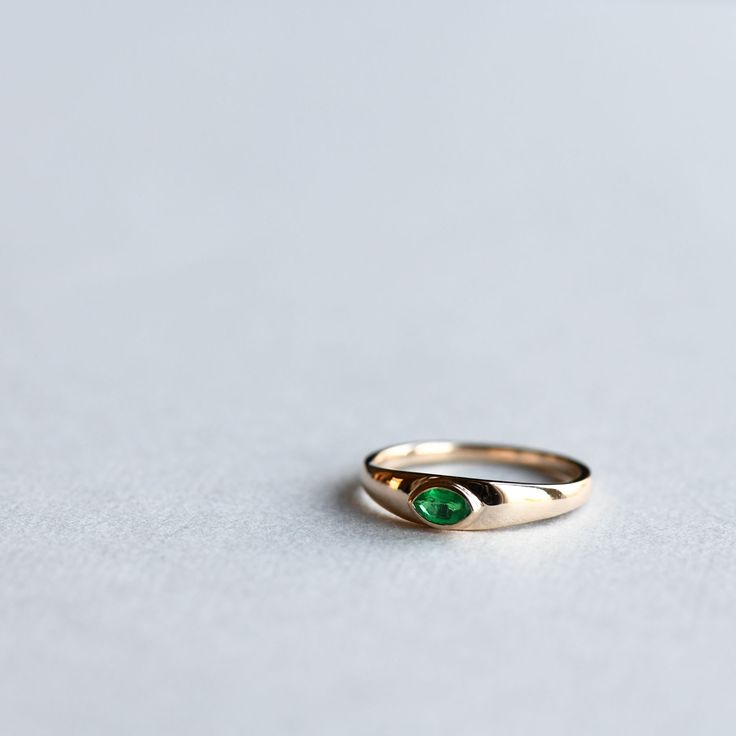 -14k yellow gold natural emerald tapered signet style ring.-Solid 14k gold with genuine natural emerald.-5mmx3mm marquise shape emerald stone.-Stone weight: 0.20 carats-14k fully hallmarked.-Approx 4mm tapered to 1.5mm band.LEAD TIME:Made to order will take 10-14 days.All of our jewelry will arrive in custom packaging ready for gift giving. Silver Signet Engagement Ring, 2022 Rings, Signet Engagement Ring, Emerald Signet Ring, Signet Engagement Rings, Rings Marriage, Graduation Ring, Fun Rings, Emerald Stone Rings